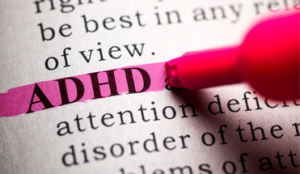 Highlighted ADHD definition with marker.