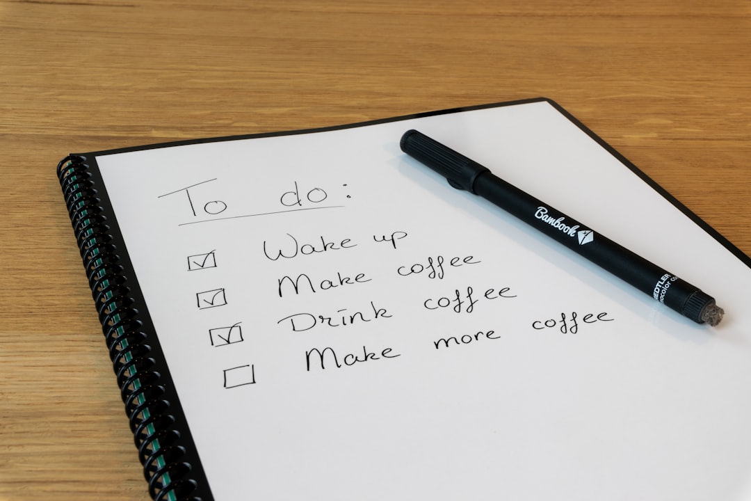 Notepad and pen representing defining the first concrete action on a delayed task