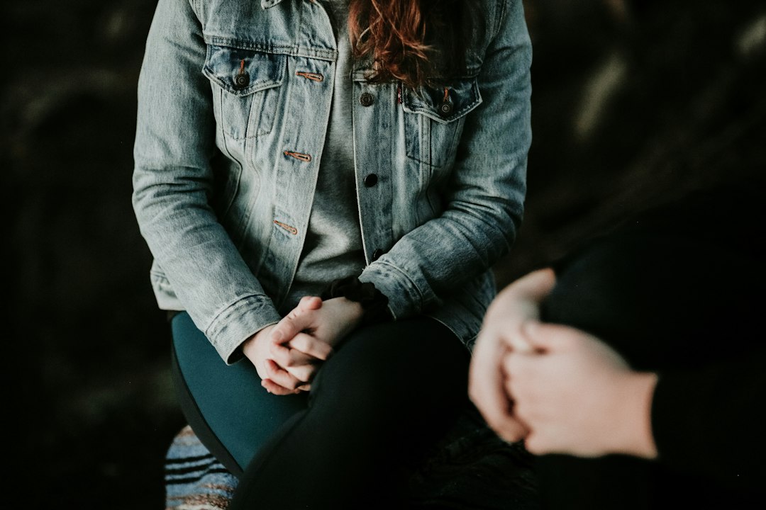 Adult seated in a calm setting, representing reflection on stress, life events, and recovery.
