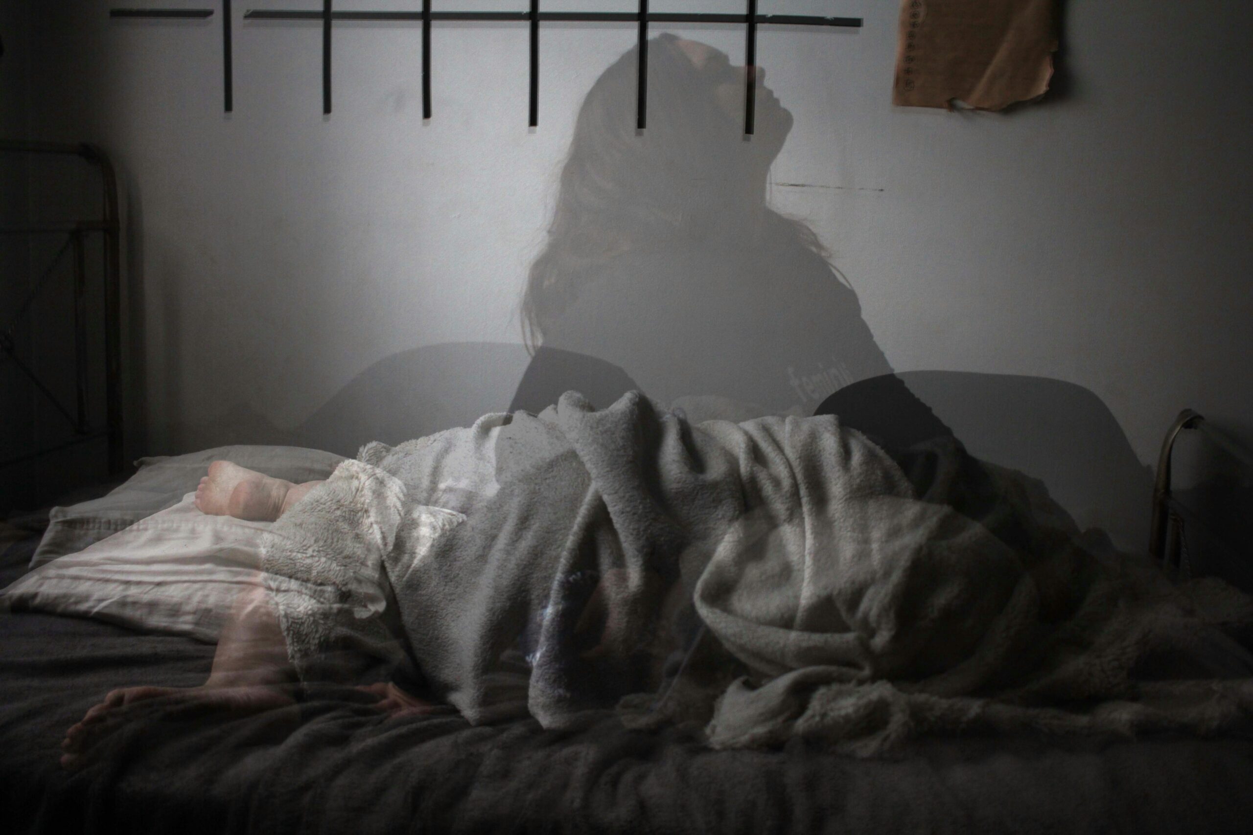 Quiet bedroom scene representing restorative sleep and mental wellness